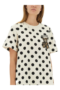 Moschino women’s white off-white t-shirt with bold black polka dots and brown teddy bear graphic on chest