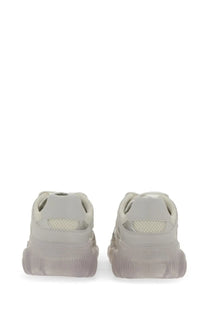 A pair of Moschino womens teddy sneaker white off-white chunky mesh sneakers with translucent textured rubber sole
