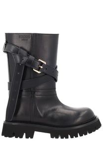 Moschino women’s black leather tie me boot with multiple straps and gold-tone buckles in a front view