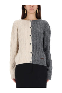 Moschino women’s two tone cable knit cardigan in cream and gray with black buttons down the center