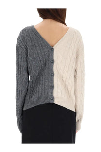 Moschino women’s two tone cable knit cardigan with gray left side cream right side and dark buttons down center