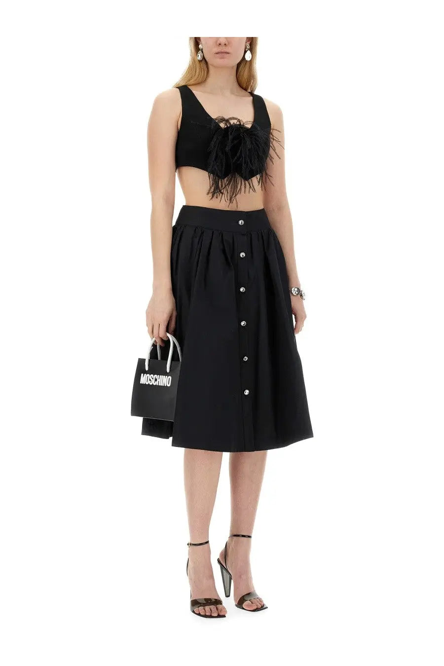 Black moschino shopping bag with white handles and bold white lettering featured with moschino women’s vests black