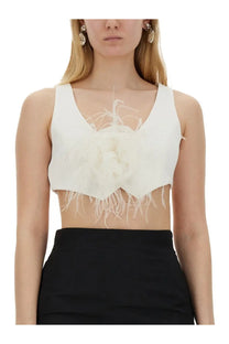 Moschino women’s white feathered crop top vest with central floral embellishment and frayed hemline