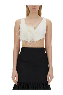 Moschino women’s white vest featuring a white feathered crop top with v-neckline and layered feathers on the front