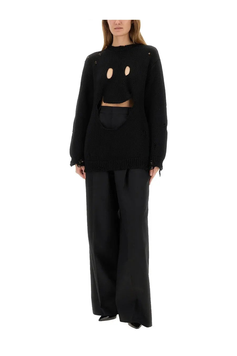 Moschino women’s black wool jersey knit sweater with eye and mouth cutouts cropped silhouette and frayed cuffs