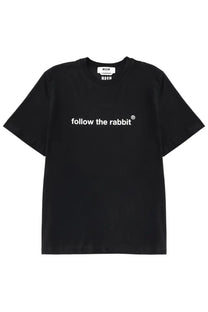 Msgm men’s black short-sleeved cotton t-shirt with white follow the rabbit text and small brand tag at neckline