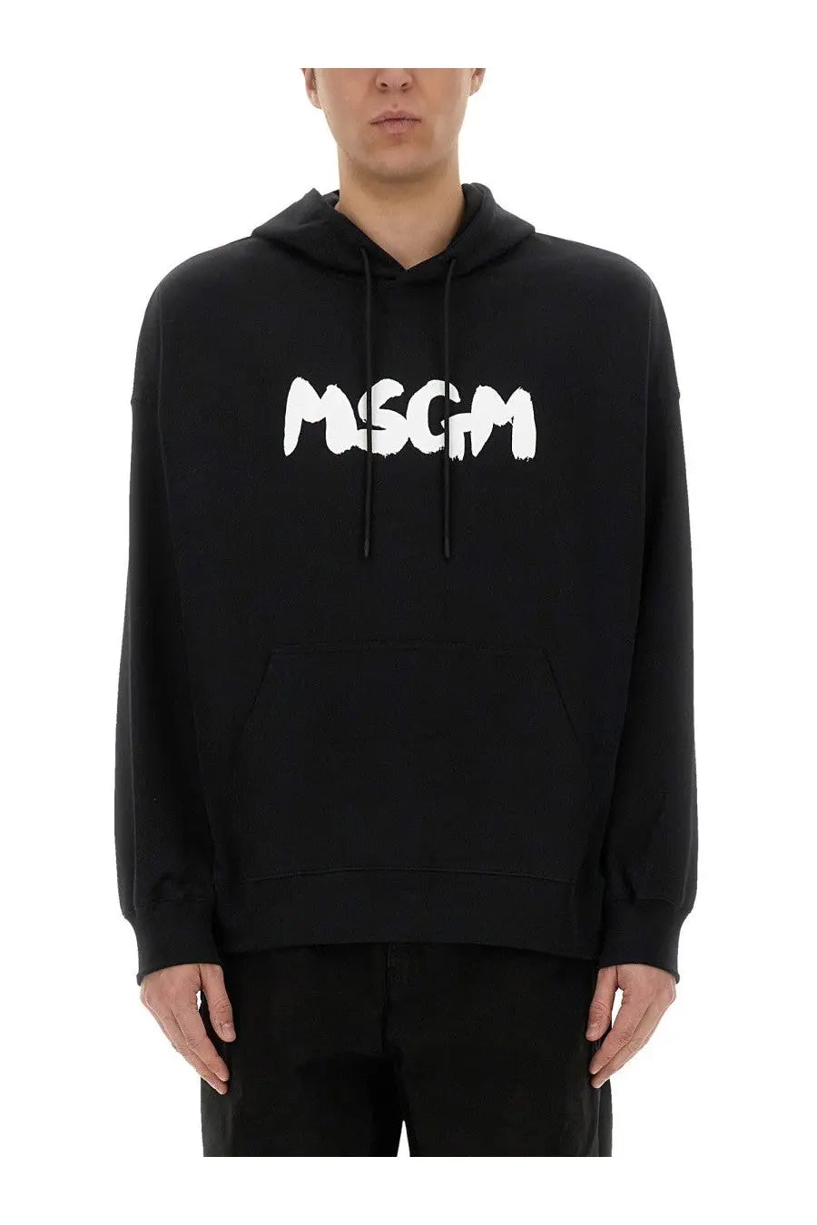 Black msgm men’s hoodie featuring bold white graffiti-style lettering on the chest in cotton material
