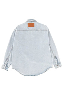 Msgm men’s light-wash denim shirt in blue with a brown leather patch at the collar
