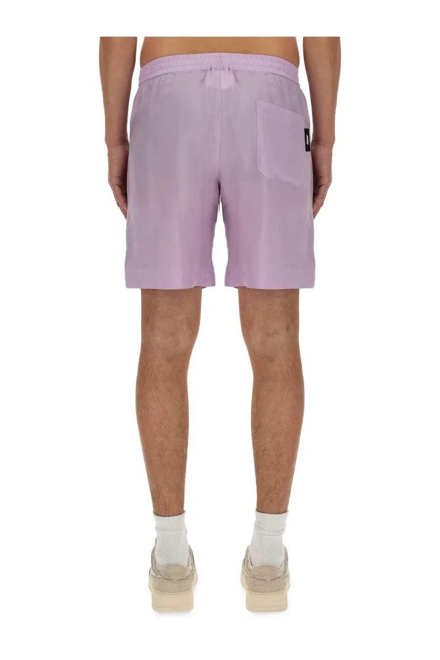 Lavender-colored MSGM men’s shorts with drawstring waistband and single back pocket shown from the back side