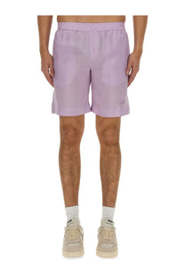 Light purple MSGM men’s athletic shorts with relaxed fit and elastic waistband for casual or sportswear use