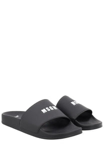 Black rubber slide sandals with bold white msgm logo on the foot strap for men con black model