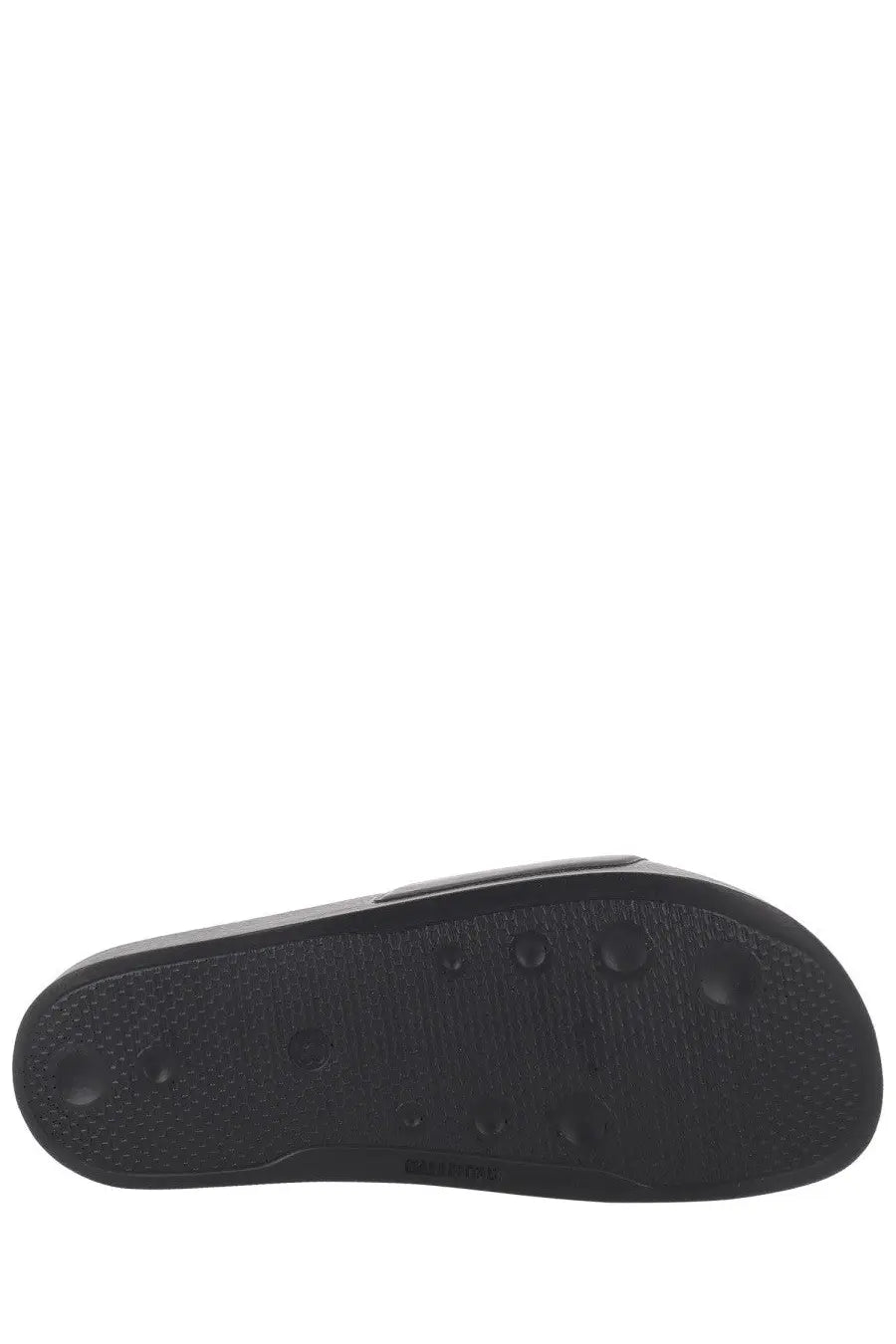 Black rubber sole of msgm men’s slide con in black with textured grip pattern and circular traction dots