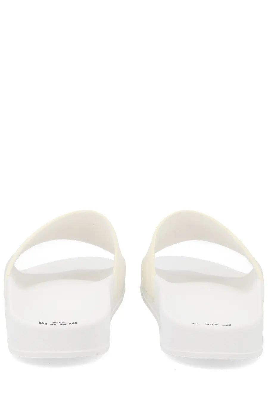Msgm men’s slide sandals in white rubber with minimalist design and subtle branding on the soles