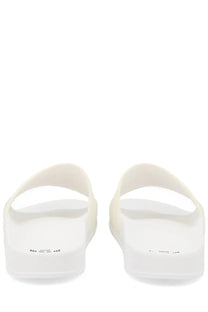 Msgm men’s slide sandals in white rubber with minimalist design and subtle branding on the soles