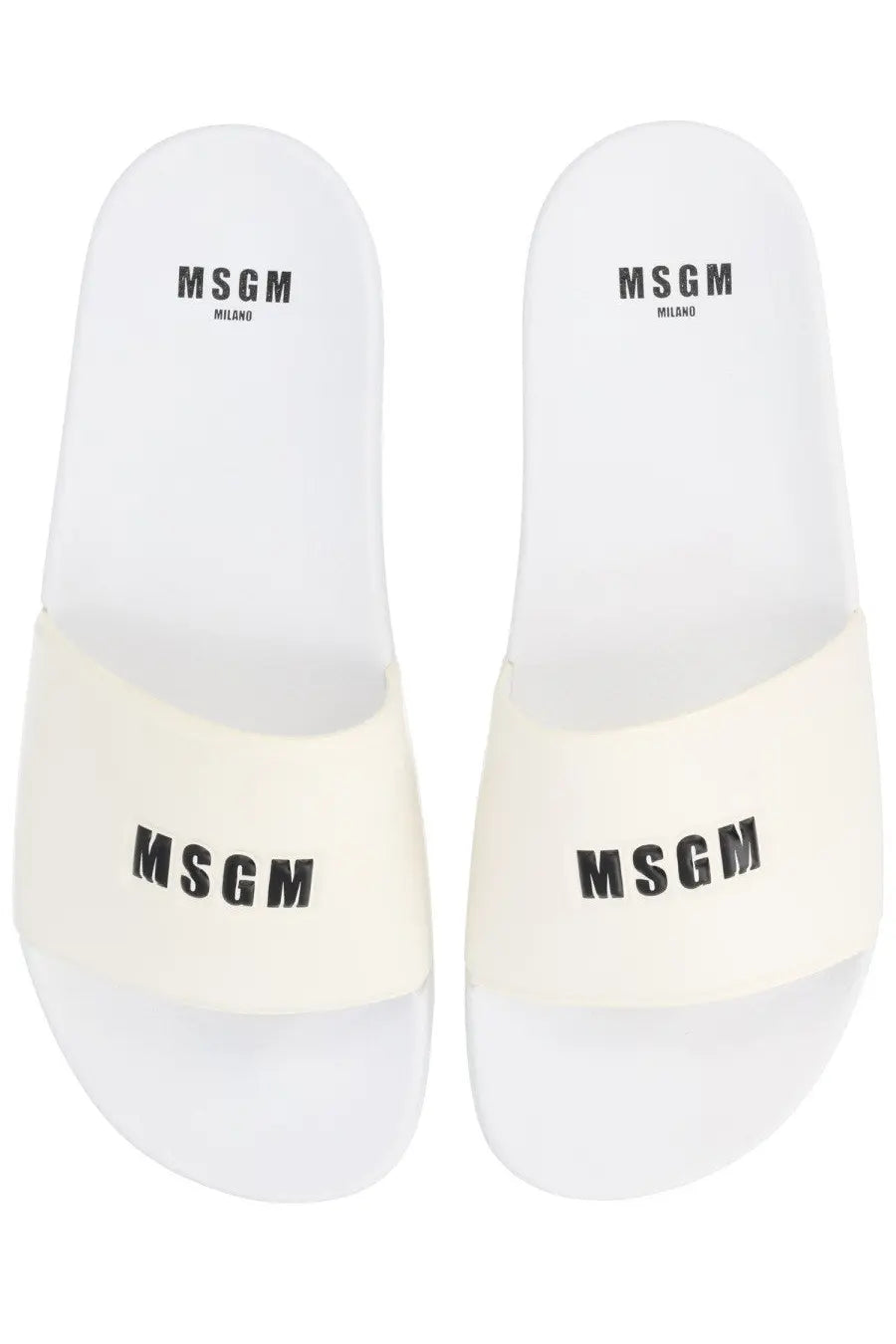 White msgm men’s slide sandals with black logo branding on the footbed and strap for casual wear