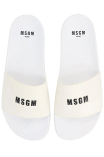 White msgm men’s slide sandals with black logo branding on the footbed and strap for casual wear