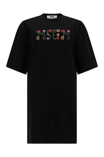 Black oversized t shirt with moschino floral appliqué embroidered in red orange yellow and purple blossoms on front