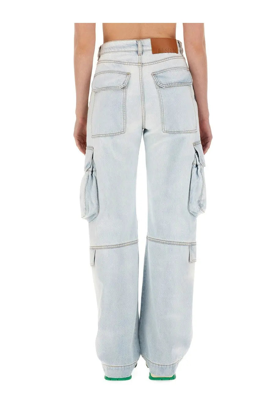 Msgm women’s light-wash denim cargo pants with multiple pockets and brown leather belt loop in blue