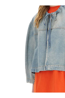 Msgm women’s light-wash denim jacket in blue with drawstring neckline and classic stitching details