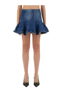 Msgm women’s denim skirt in medium blue wash featuring a flared design, visible stitching, and frayed hem