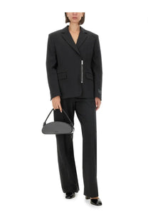 Black leather handbag with curved minimalist design and chain strap featured with msgm women’s black jacket