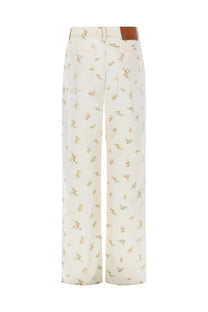 Msgm women’s cream wide-leg trousers with delicate peach green floral print and brown leather waistband patch