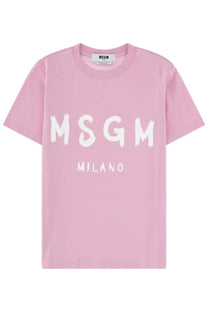 A soft pink msgm womens t shirt with bold white brushstroke lettering across the chest from the con blue collection