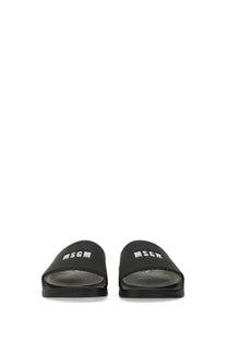Black msgm women’s slide sandal featuring white logo branding on the strap for casual wear