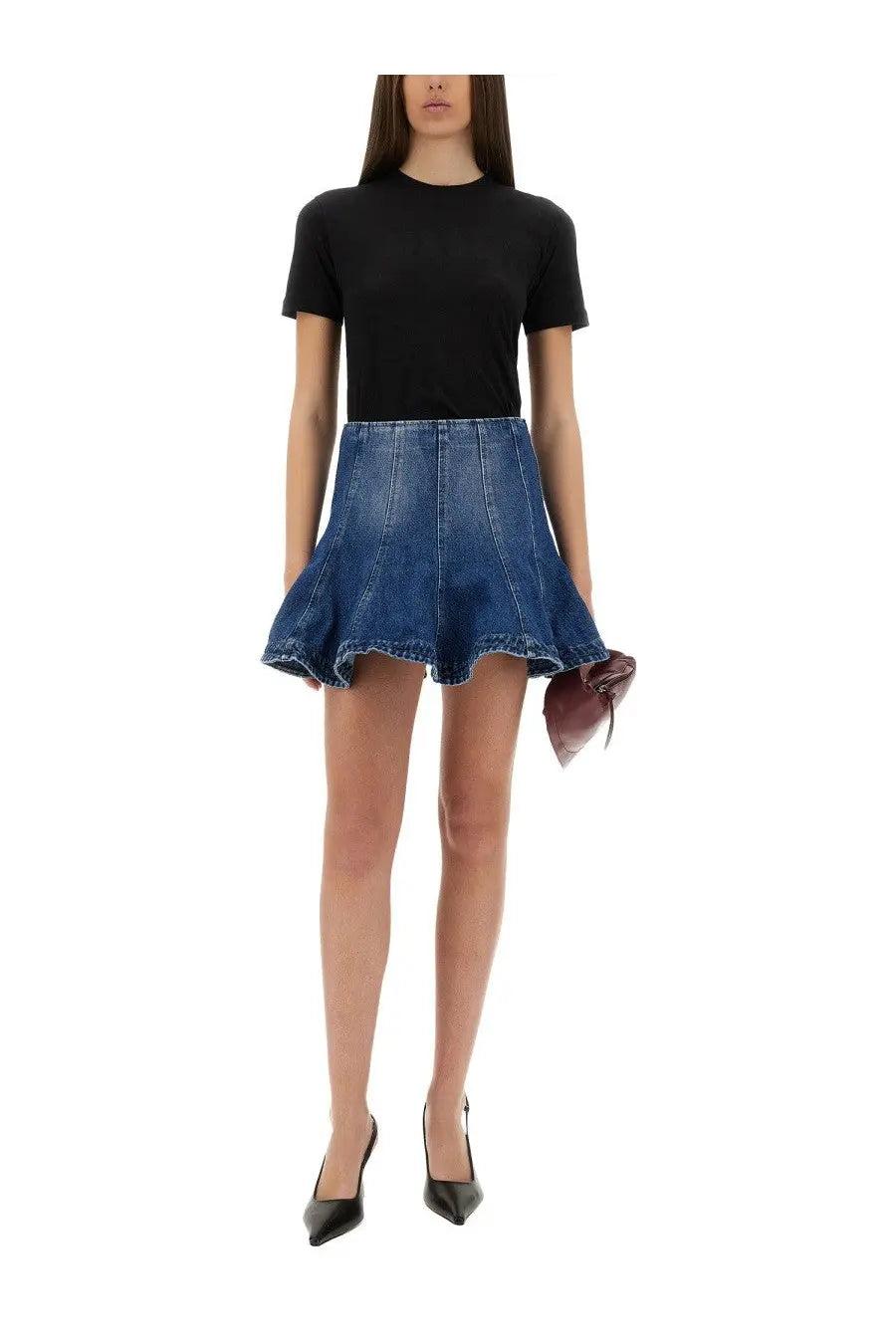 Blue denim flared mini skirt paired with msgm women’s slim fit black shirt in a casual outfit