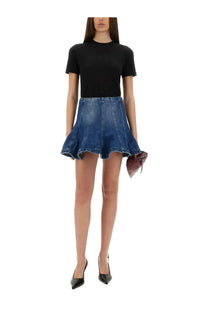 Blue denim flared mini skirt paired with msgm women’s slim fit black shirt in a casual outfit