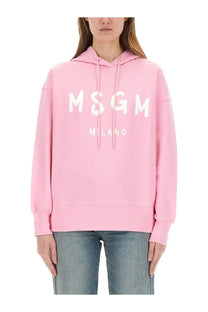 Pink MSGM Milano hoodie with white lettering and matching drawstrings in a product titled MSGM women’s sweatshirt blue