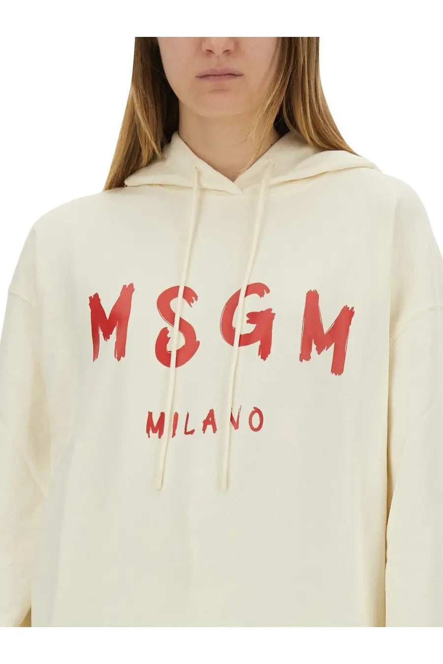 Cream-colored MSGM women’s sweatshirt with bold red brushstroke lettering and milano print on the front