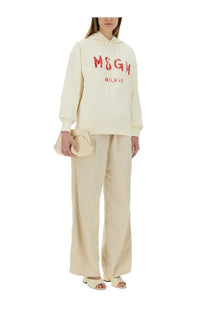 Cream-colored msgm milano hoodie with bold red lettering across the chest in msgm women’s sweatshirt white