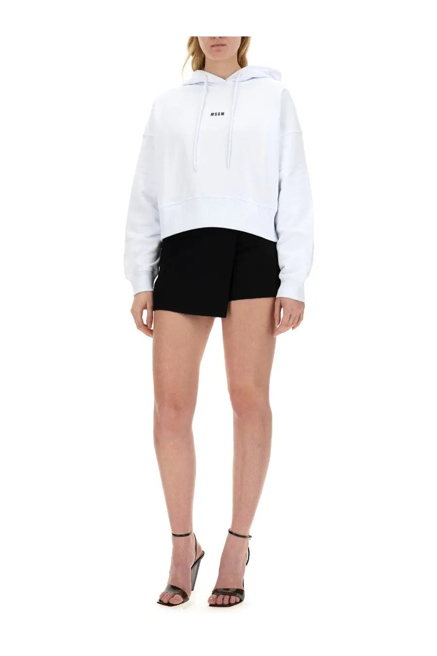 Msgm women’s white oversized hoodie with subtle black logo on chest made from soft cotton sweatshirt material