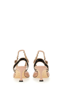 N°21 women’s slingback beige leather heels with black patterned straps and slender heel shown from the back