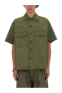 Olive green short-sleeved utility cotton shirt for men with two flap pockets and dark buttons by needles