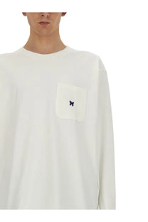 Needles men’s white long-sleeve t-shirt with matching pocket and small embroidered purple butterfly logo