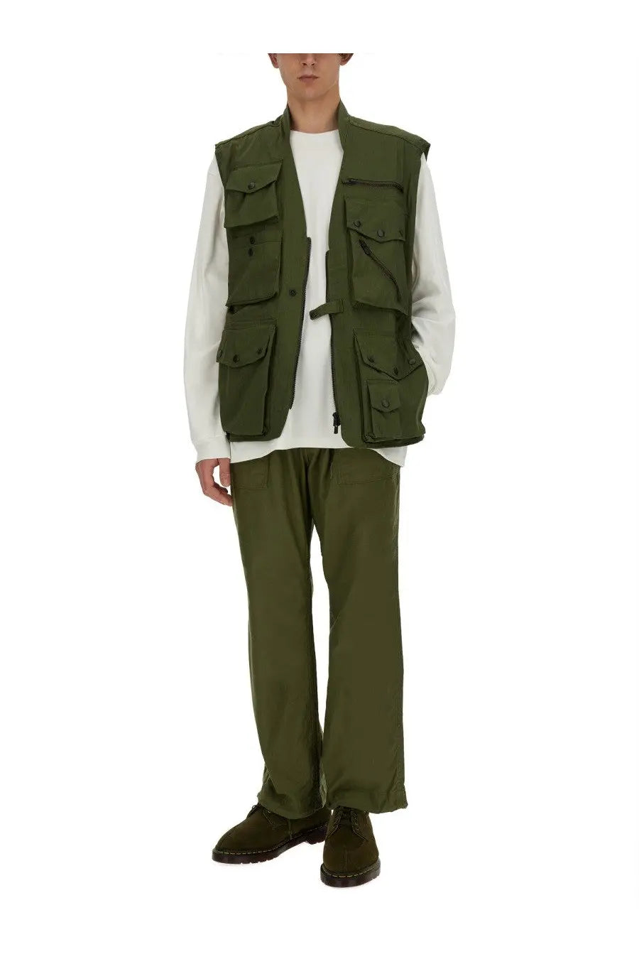Olive green utility vest with multiple pockets and buttoned front closure paired with needles men’s white shirt