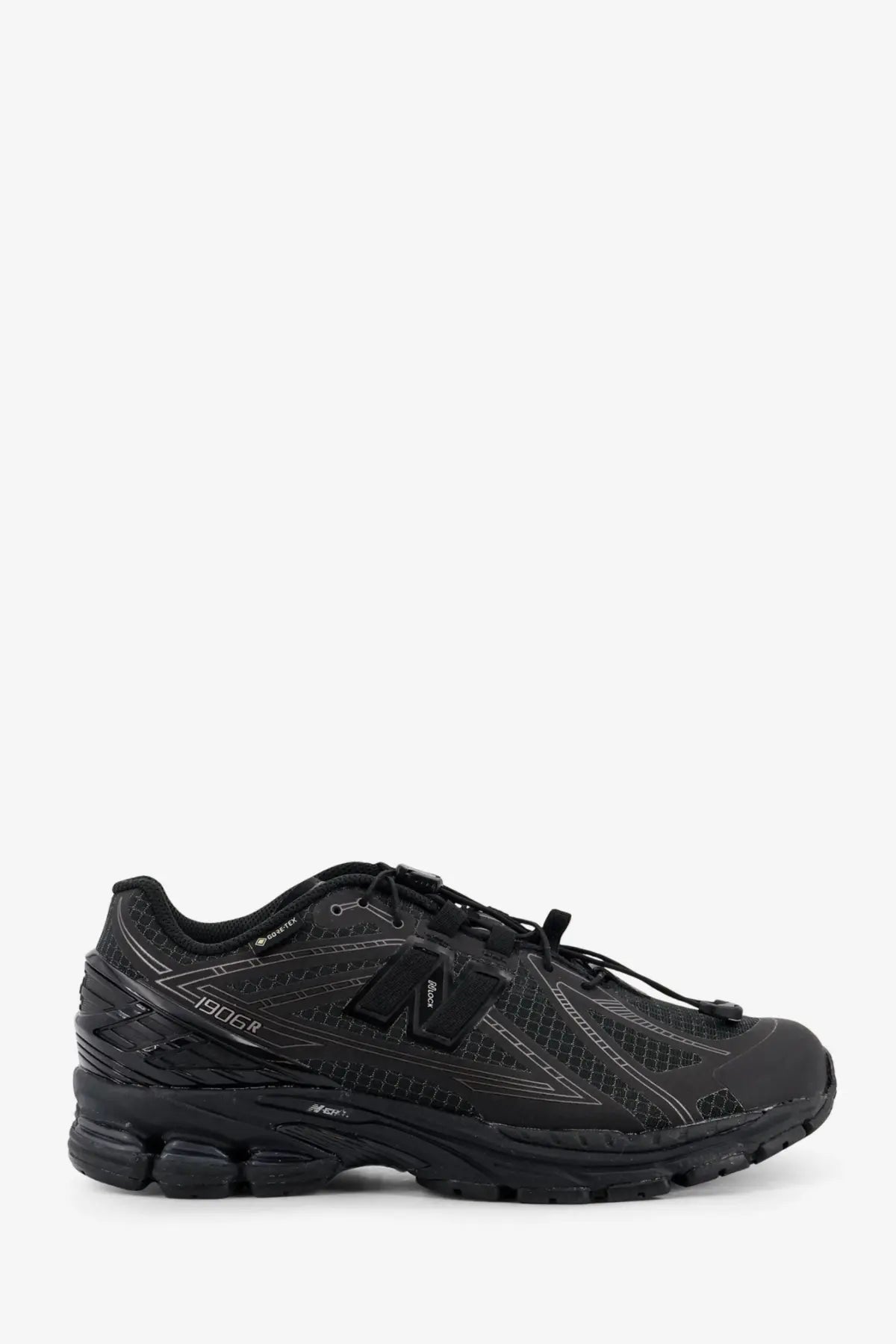 New Balance men’s Gore Tex black 1906r running shoe with mesh and synthetic overlays and subtle gray stitching