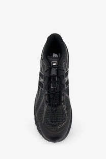 New Balance men’s Gore Tex black running shoe with mesh upper and rubber outsole for outdoor use