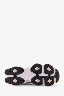 New balance men’s low top mesh sneakers beige with white and black chunky sole featuring diamond shaped rubber grips
