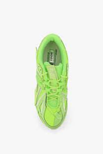 New Balance men’s low top mesh sneakers in vibrant neon green with mesh and synthetic overlays for comfort and style