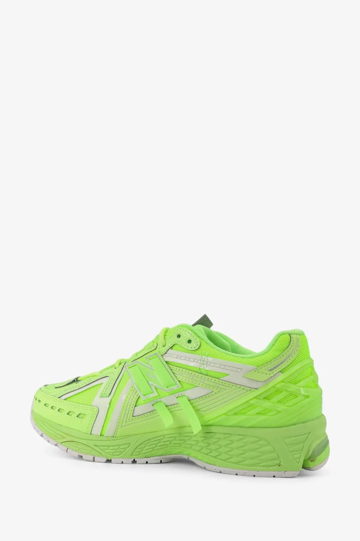 New Balance men’s low top mesh sneaker in vibrant neon green with white accents and a textured rubber sole