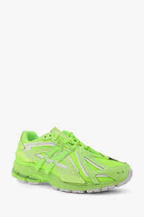 New Balance men’s low top mesh sneaker in vibrant neon green with white accents and a chunky sole