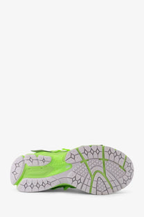 New Balance men’s low top mesh sneakers in green with a vibrant neon green and white geometric tread sole