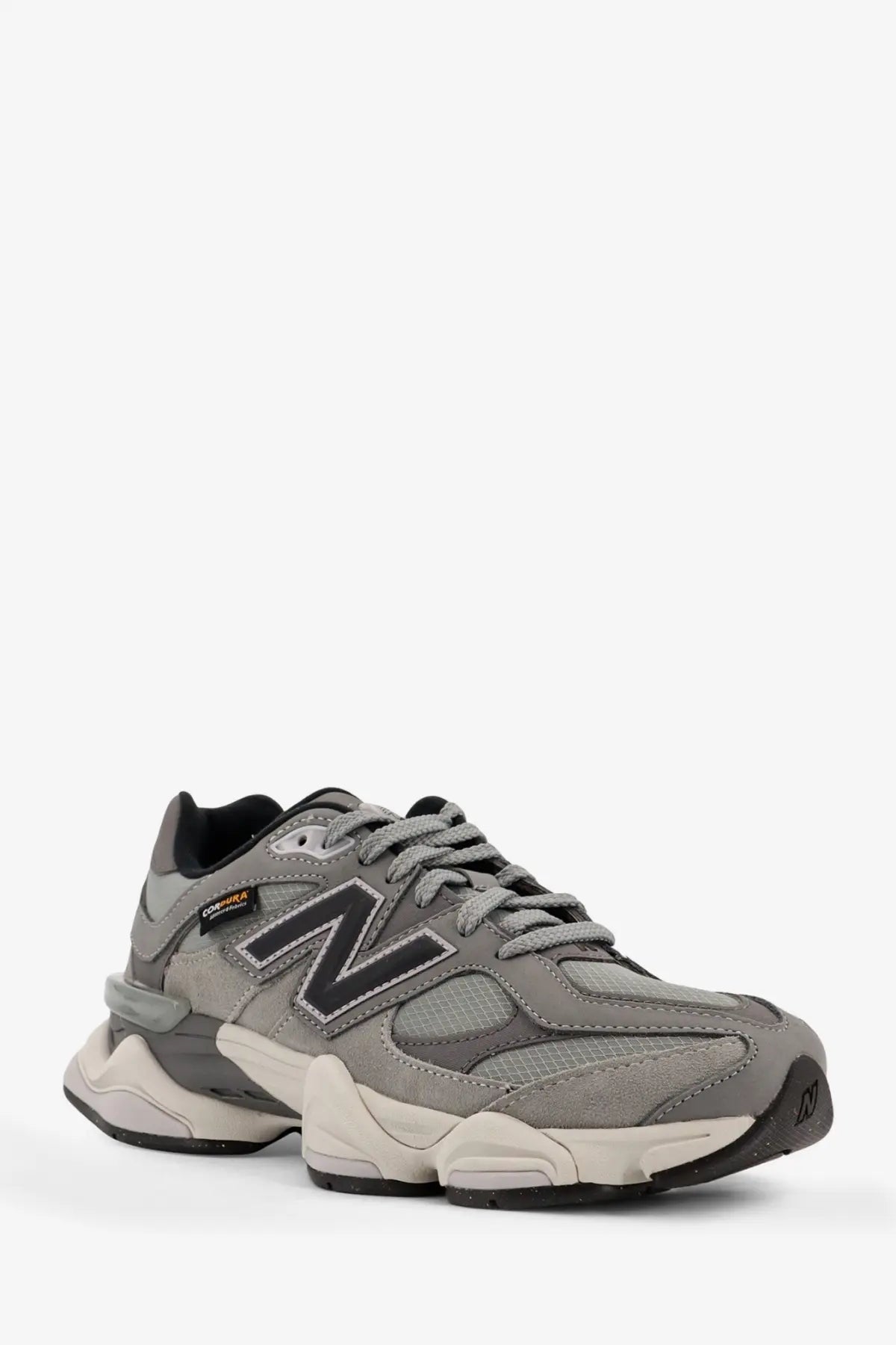 New Balance men’s low top mesh sneakers grey with gray and black color and chunky layered sole design