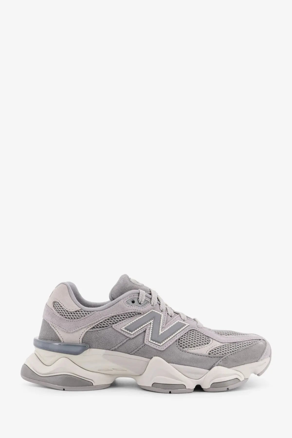 New balance men’s low top gray sneakers with mesh and suede upper and chunky white and gray sole