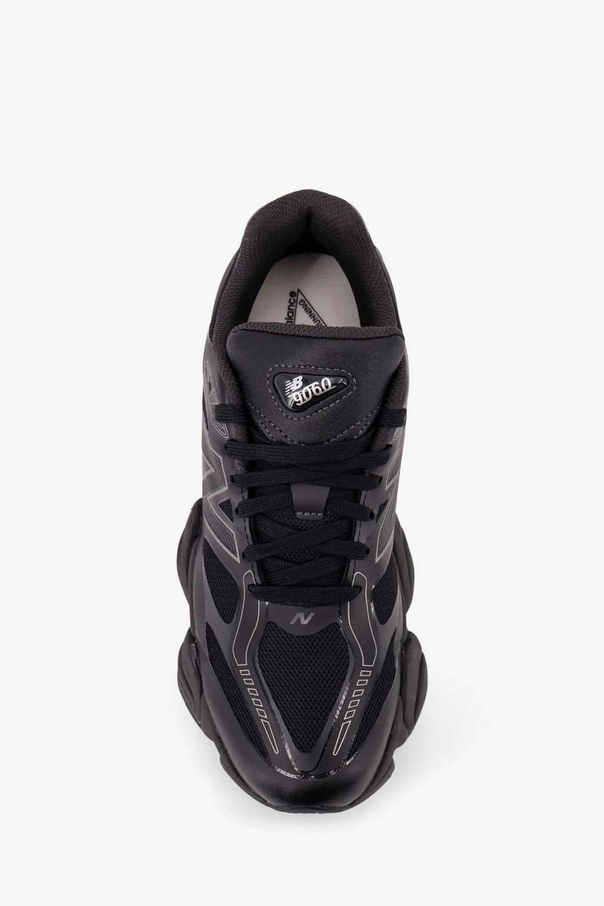 New Balance men’s black mesh sneakers with chunky layered sole and breathable mesh detailing