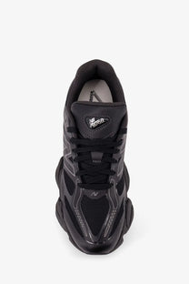 New Balance men’s black mesh sneakers with chunky layered sole and breathable mesh detailing