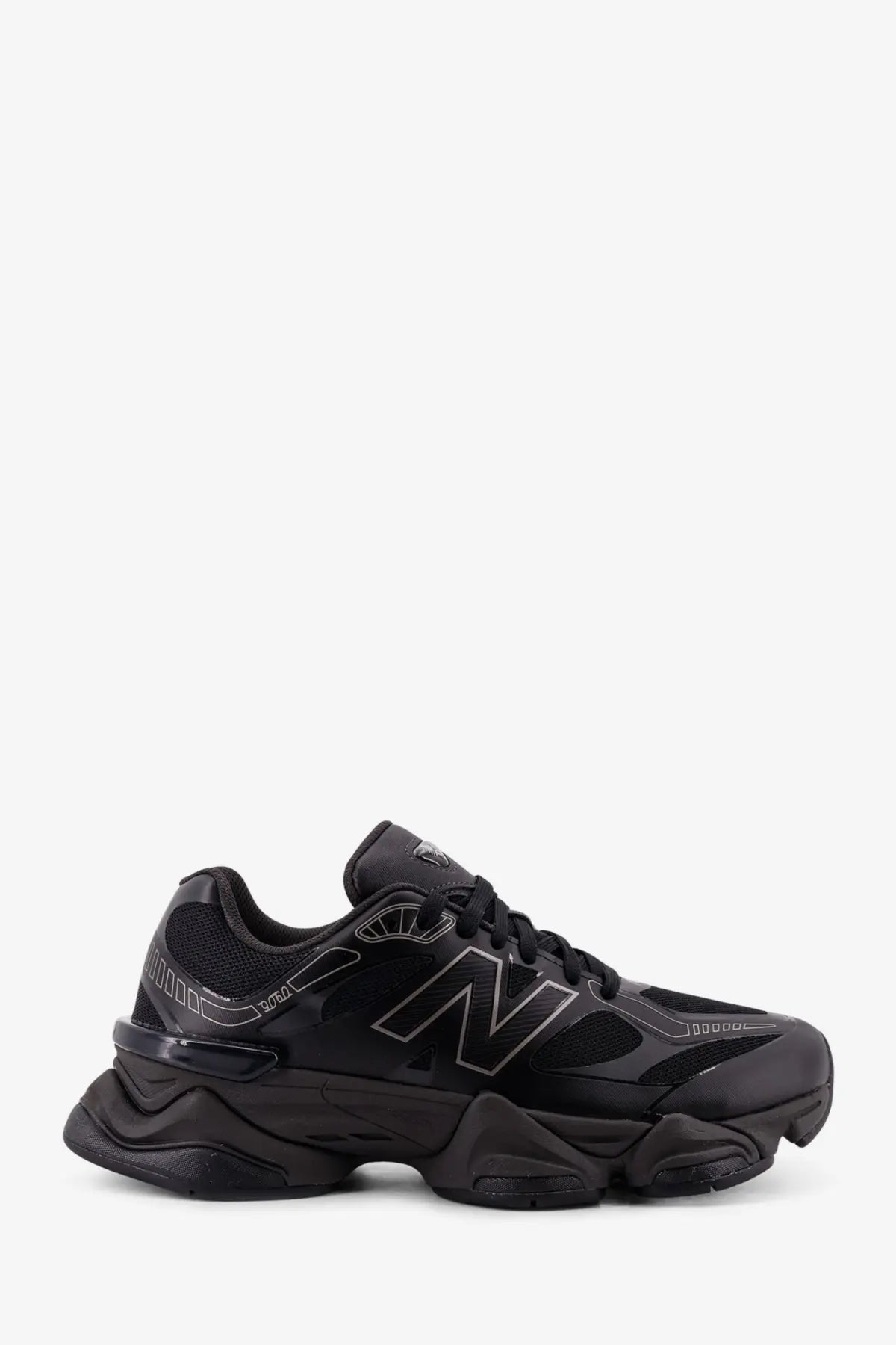 New balance men’s black mesh sneakers with chunky textured sole and subtle gray logo detailing